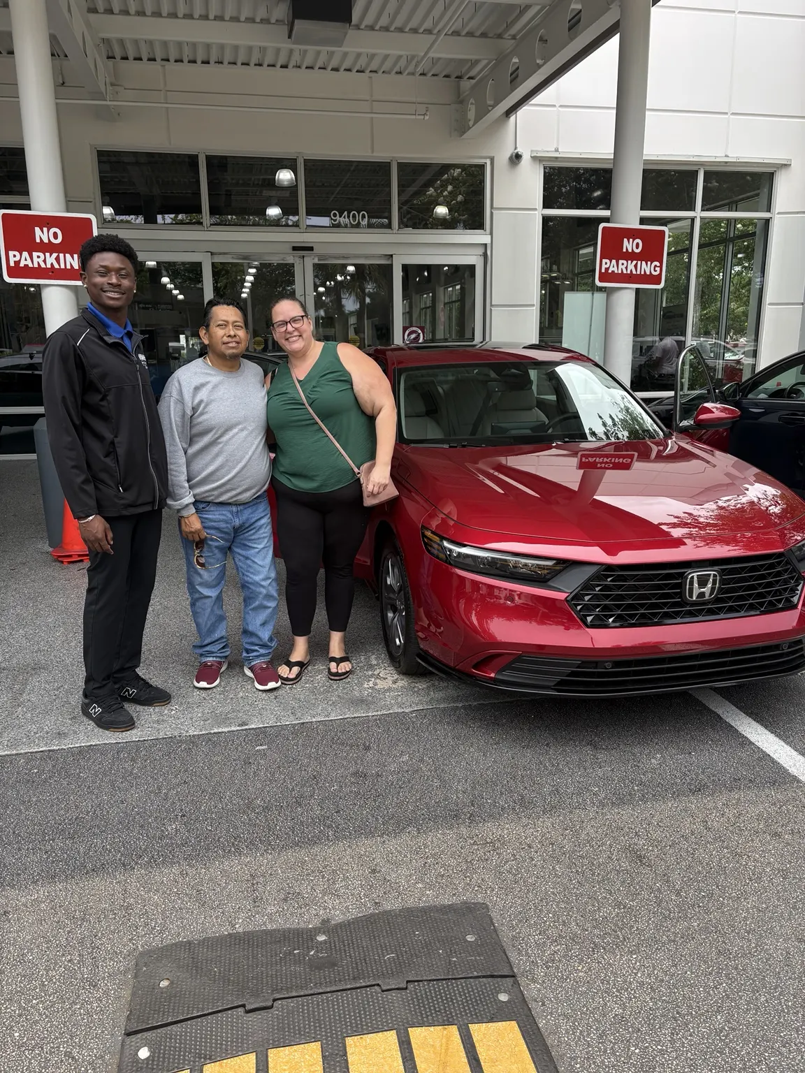 Greg with a customer and their vehicle