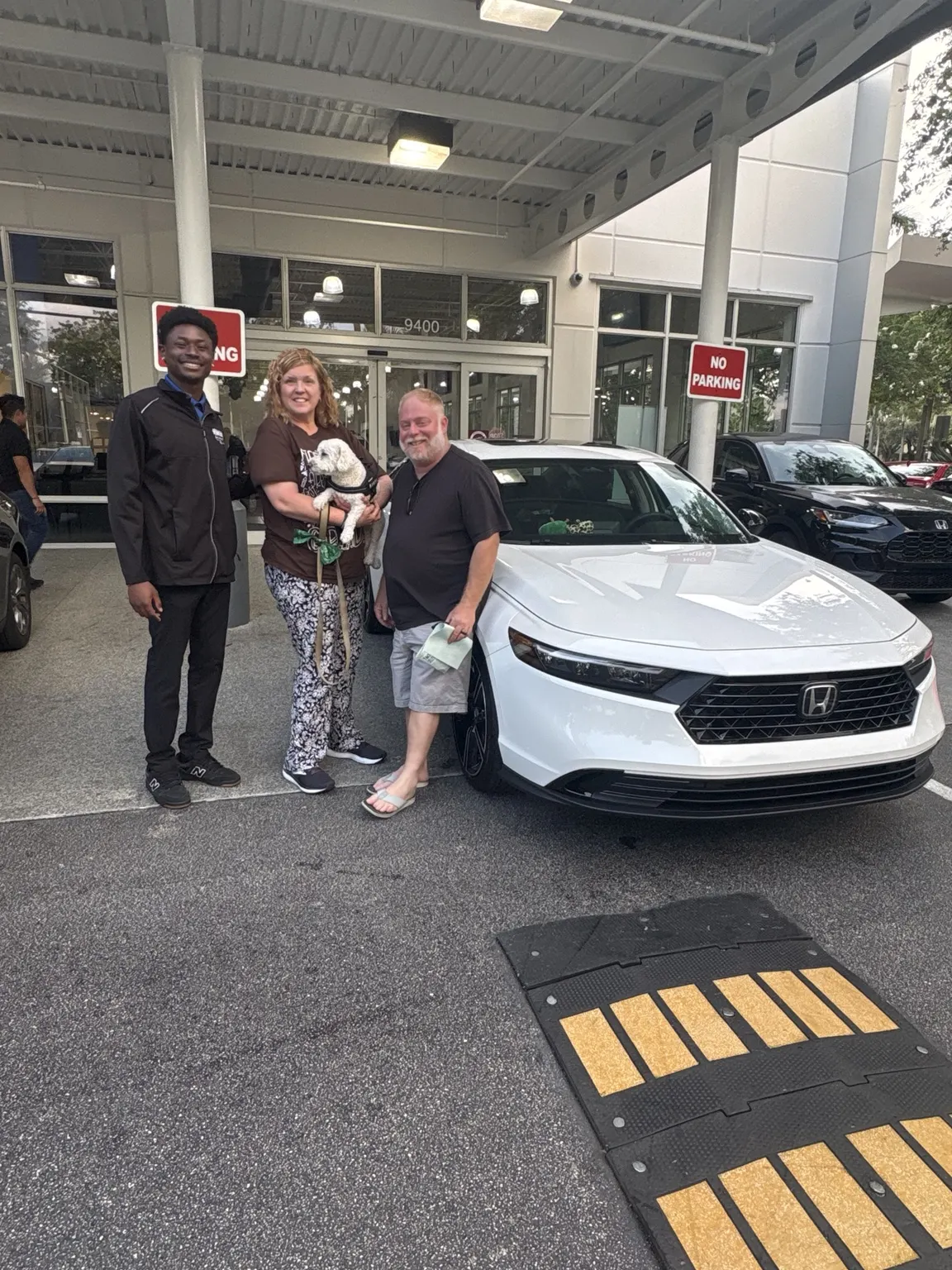 Greg with a customer and their vehicle