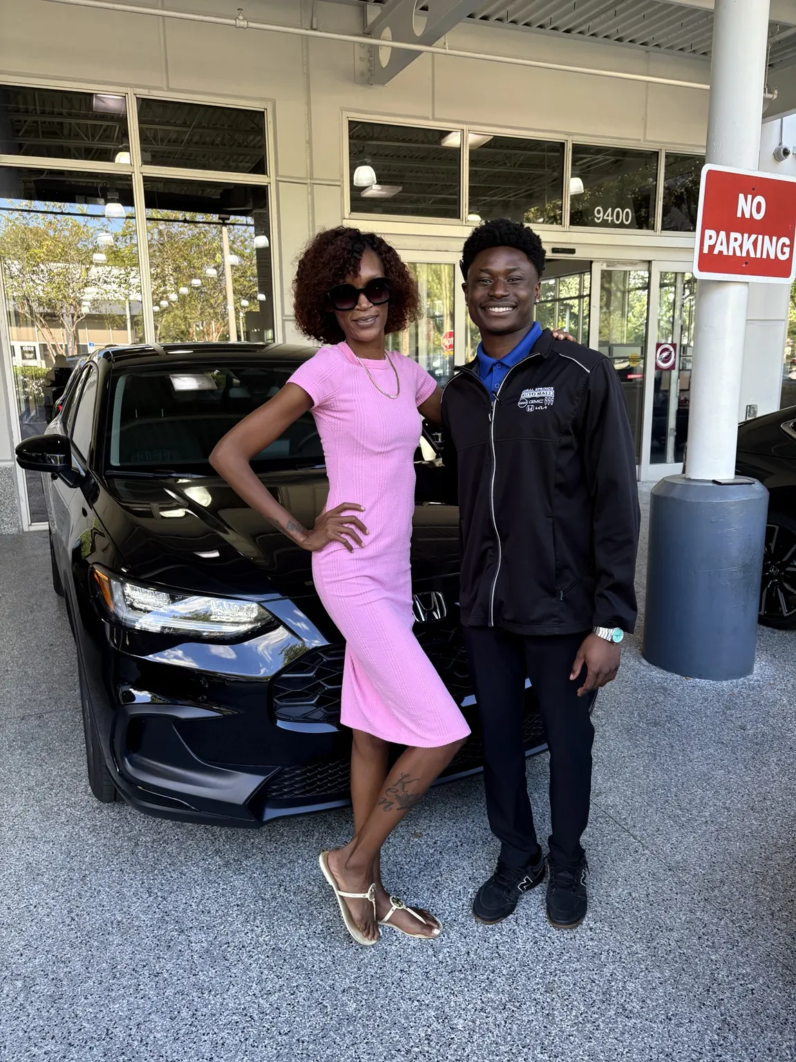 Greg with a customer and their vehicle